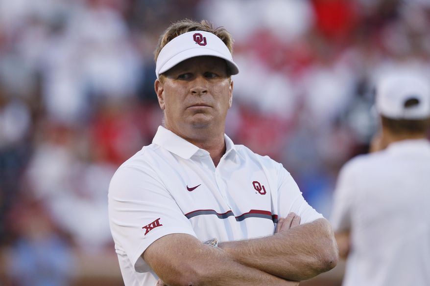 FILE - In this Sept. 17, 2016, file photo, Oklahoma defensive coordinator Mike Stoops watches his team before an NCAA college football game against Ohio State, in Norman, Okla. As has often been the case over his career, defensive coordinator Mike Stoops has bounced back. The unit, led by second-team All-American linebacker Ogbonnia Okoronkwo, has improved steadily since a rough mid-season outing against Oklahoma State. (AP Photo/Sue Ogrocki, File)