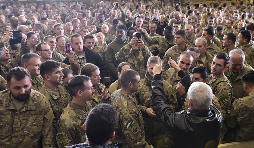 U.S. Vice President Mike Pence sgreets troops in a hangar at Bagram Air Base in Afghanistan on Thursday, Dec. 21, 2017. Mandel Ngan/Pool via AP) **FILE**