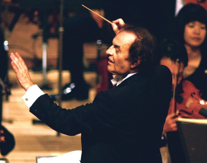 FILE - In this June 19, 2003 file photo, conductor Charles Dutoit performs with NHK Symphony Orchestra in Tokyo, Japan. Four women have accused Dutoit of sexual misconduct that allegedly occurred on the sidelines of rehearsals or performances with some of America's great orchestras. The 81-year-old is the artistic director and principal conductor at London's Royal Philharmonic Orchestra. (Kyodo News via AP)