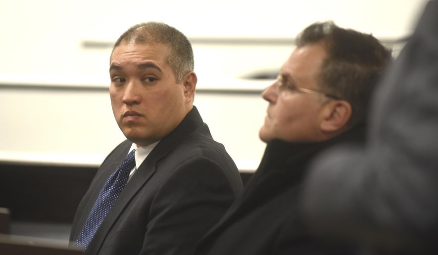 Former Michigan State Trooper Mark Besner, left, sits with his attorney, Richard Convertino, during his arraignment in 36th District Court in Detroit, Thursday, Dec. 21, 2017.   His lawyer has entered a not-guilty plea.  Besner is charged in the death of a Detroit teen and says they'll face the case "head-on." (Max Ortiz/Detroit News via AP)