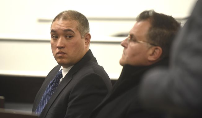 Former Michigan State Trooper Mark Besner, left, sits with his attorney, Richard Convertino, during his arraignment in 36th District Court in Detroit, Thursday, Dec. 21, 2017.   His lawyer has entered a not-guilty plea.  Besner is charged in the death of a Detroit teen and says they'll face the case "head-on." (Max Ortiz/Detroit News via AP)
