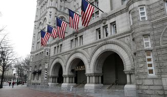 FILE- In this Dec. 21, 2016 file photo, the Trump International Hotel in Washington is shown. On Thursday, Dec. 21, 2017, a New York judge has rejected a lawsuit by restaurant workers, a hotel event booker and a watchdog group who say President Donald Trump has business conflicts that violate the Constitution. The lawsuit was rejected by federal Judge George Daniels, who says the plaintiffs lacked standing to sue. (AP Photo/Alex Brandon, File)