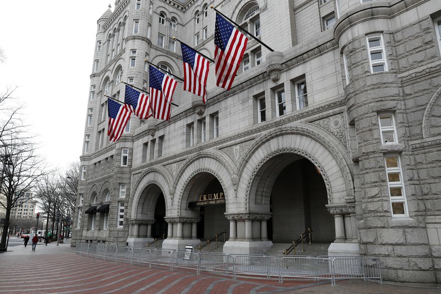 FILE- In this Dec. 21, 2016 file photo, the Trump International Hotel in Washington is shown. On Thursday, Dec. 21, 2017, a New York judge has rejected a lawsuit by restaurant workers, a hotel event booker and a watchdog group who say President Donald Trump has business conflicts that violate the Constitution. The lawsuit was rejected by federal Judge George Daniels, who says the plaintiffs lacked standing to sue. (AP Photo/Alex Brandon, File)
