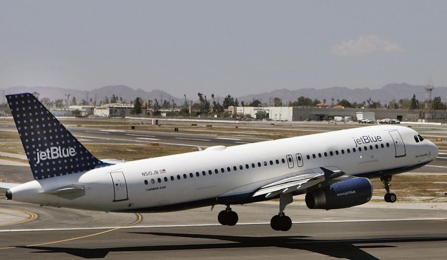 FILE - In this April 18, 2007, file photo, an Airbus A320 JetBlue aircraft lands at the Bob Hope Airport in Burbank, Calif. A JetBlue flight in December 2017 continued to its final destination after three passengers reported a mother mistreating her 8-year-old son, including grabbing him by the neck and shoving him against a window as he cried. Flight crews can restrain passengers or even divert flights when fights or other violent behavior erupts midair, but when the situation involves a parent potentially abusing a child, the decisions are not so clear cut. (AP Photo/Damian Dovarganes, File)