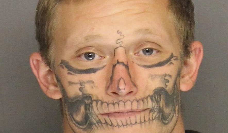 FILE - This undated file photo provided by the San Joaquin County Sheriff's Office shows inmate Corey Hughes. Authorities say that Hughes, who has a skull tattooed on his face and escaped last month from a work crew in central California, was arrested Thursday, Dec. 22, 2017. (San Joaquin County Sheriff's Office via AP, file)
