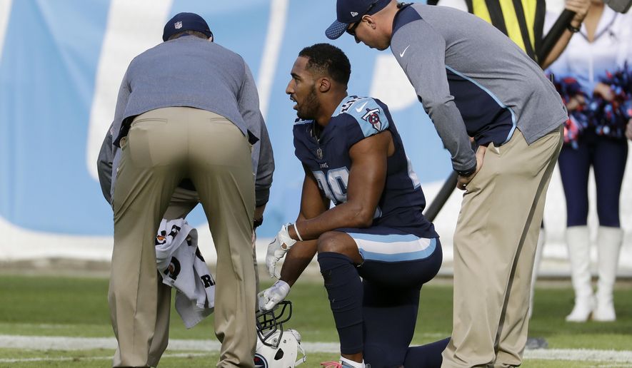 FILE - In this Sunday, Dec. 3, 2017, file photo ,Tennessee Titans defensive back Logan Ryan (26) is attended to after getting injured in the second half of an NFL football game against the Houston Texans in Nashville, Tenn. The Titans already are without one of their cornerbacks and could be without a starter Logan Ryan on Sunday against the Los Angeles (AP Photo/James Kenney, File)