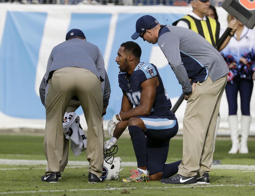 FILE - In this Sunday, Dec. 3, 2017, file photo ,Tennessee Titans defensive back Logan Ryan (26) is attended to after getting injured in the second half of an NFL football game against the Houston Texans in Nashville, Tenn. The Titans already are without one of their cornerbacks and could be without a starter Logan Ryan on Sunday against the Los Angeles (AP Photo/James Kenney, File)