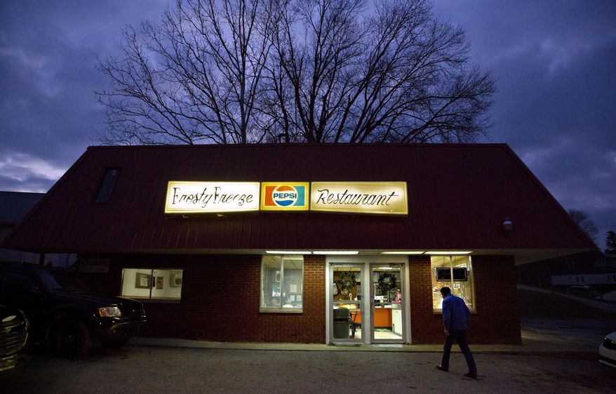 ADVANCE FOR USE WEDNESDAY, DEC. 27, 2017 AND THEREAFTER-A customer walks into the Frosty Freeze restaurant in Sandy Hook, Ky., Thursday, Dec. 14, 2017. Everyone in town comes to this diner for nostalgia and homestyle cooking and, recently, news reporters come from all over the world to puzzle over politics. Because Elliott County, a blue-collar union stronghold, voted for the Democrats in each and every presidential election for its 147-year existence. Until Donald Trump came along and promised to wind back the clock. (AP Photo/David Goldman)