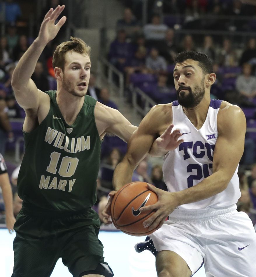 TCU guard Alex Robinson (25) drives against William & Mary guard Connor Burchfield (10) during the first half of an NCAA college basketball game in Fort Worth, Texas, Friday, Dec. 22, 2017. (AP Photo/LM Otero)