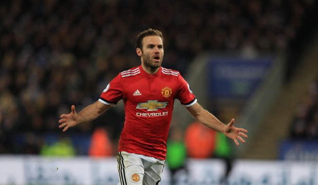 Manchester United&#x27;s Juan Mata celebrates scoring his side&#x27;s second goal of the game during their English Premier League soccer match against Leicester City at the King Power Stadium, Leicester, England, Saturday, Dec. 23, 2017. (Mike Egerton/PA via AP)