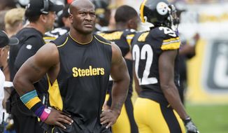 In this Oct. 8, 2017, photo, Pittsburgh Steelers outside linebacker James Harrison walks the sidelines as his team plays against the Jacksonville Jaguars in an NFL football game in Pittsburgh. Harrison&#x27;s long tenure with the Steelers is over. The AFC North champions released the five-time Pro Bowl linebacker and 2008 NFL defensive player of the year to make room for right tackle Marcus Gilbert. (AP Photo/Fred Vuich)