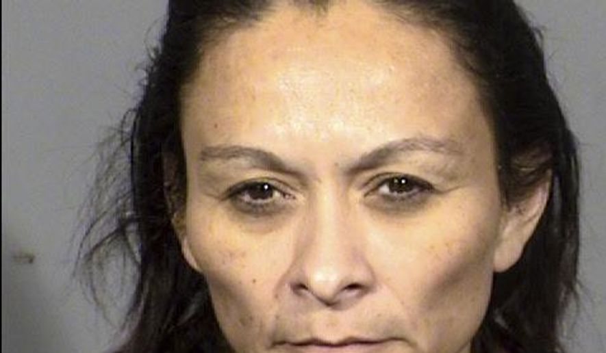 This booking photo provided by Las Vegas Metropolitan Police Department on Saturday, Dec. 23, 2017 shows Christine Sanchez, 47. Sanchez is accused of fatally shooting her three roommates on Dec. 22. (Las Vegas Metropolitan Police Department via The AP)