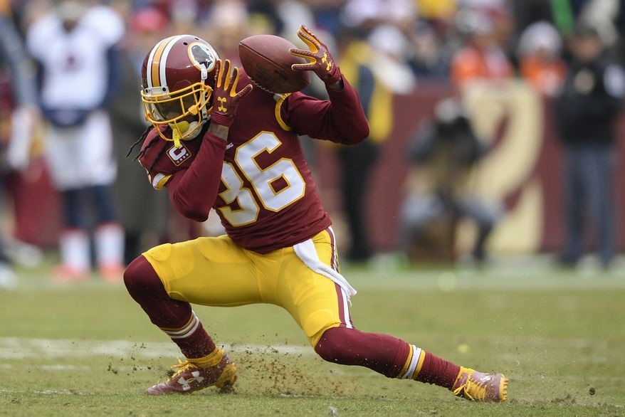 Washington Redskins free safety D.J. Swearinger (36) struggles with a pass reception during the first half an NFL football game against the Denver Broncos in Landover, Md., Sunday, Dec 24, 2017. (AP Photo/Nick Wass) **FILE**