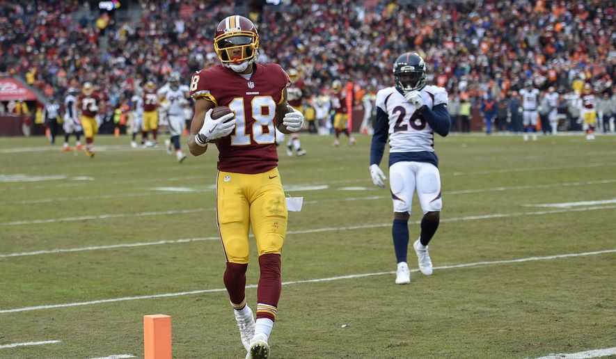 Washington Redskins wide receiver Josh Doctson (18) carries the ball into the end zone for a touchdown during the second half an NFL football game against the Denver Broncos in Landover, Md., Sunday, Dec 24, 2017. (AP Photo/Nick Wass) **FILE**