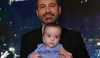This Dec. 11, 2017 image released by ABC shows host Jimmy Kimmel with his son Billy on the set of &quot;Jimmy Kimmel Live!&quot; Kimmel held his baby son as he returned to his late-night show after a week off for the boy&#39;s heart surgery. Kimmel kept up his ardent advocacy Monday night, urging Congress to restore the Children&#39;s Health Insurance Program, which has been left unfunded and stuck in a political stalemate since September. (Randy Holmes/ABC via AP)