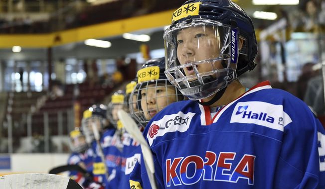 In this photo taken Sept. 24, 2017, South Kore;s Marissa Brandt yells instructions to teammates as they play Minnesota in the second period of an exhibition hockey game in Minneapolis. Marissa, a native Korean who was adopted as an infant by parents in Minnesota, and her sister Hannah will both be playing in the upcoming Winter Olympics in women&#x27;s hockey. Marissa for South Korea and Hannah for the U.S. (AP Photo/John Autey)