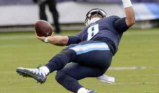 Tennessee Titans quarterback Marcus Mariota falls on the Titans&#39; final drive late in the fourth quarter of an NFL football game against the Los Angeles Rams Sunday, Dec. 24, 2017, in Nashville, Tenn. The Rams won 27-23. (AP Photo/Mark Zaleski)