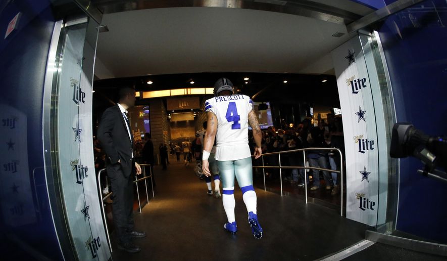 Dallas Cowboys' Dak Prescott (4) walks into the team's clubhouse tunnel after their NFL football game against the Seattle Seahawks on Sunday, Dec. 24, 2017, in Arlington, Texas. The Seahawks won 21-12. (AP Photo/Ron Jenkins)