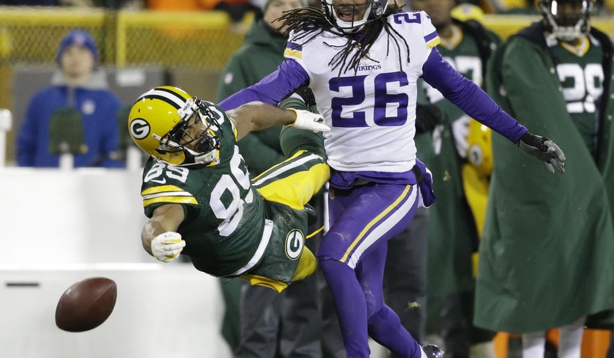Minnesota Vikings' Trae Waynes breaks up a pass intended for Green Bay Packers' Michael Clark during the fourth quarter of an NFL football game Saturday, Dec. 23, 2017, in Green Bay, Wis. The Vikings won 16-0. (AP Photo/Jeffrey Phelps)