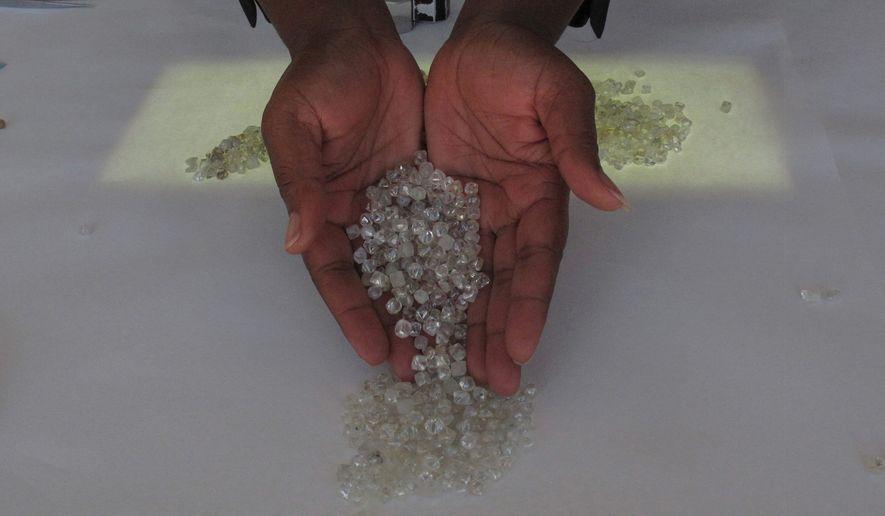 Kimberley Process authorities have sought to implement a storage and marking system to address difficulty that officials are having in preventing blood diamonds from blending with legal gems. (Associated Press/File)