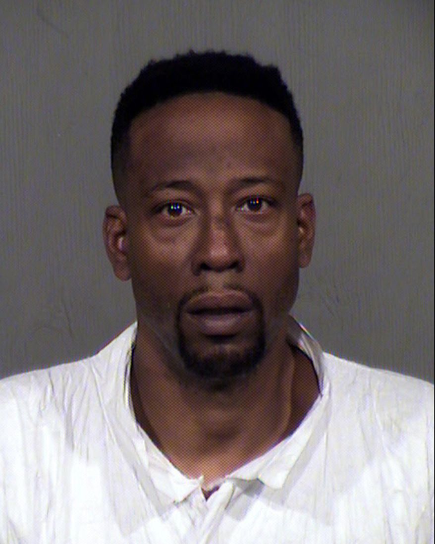In this Monday, Dec. 25, 2017, photo provided by Maricopa County Sheriff's Office shows suspect Anthony Ross in Phoenix, Ariz. Ross is accused of shooting and killing his estranged wife and their two children at a Phoenix apartment complex before getting into a Christmas Day shootout with officers, authorities said Tuesday, Dec. 26. (Maricopa County Sheriffs Office via AP)