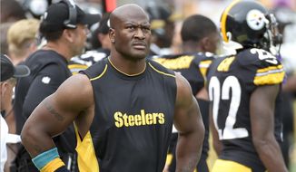 FILE - In this Oct. 8, 2017 file photo, Pittsburgh Steelers linebacker James Harrison walks the sidelines as his team plays against the Jacksonville Jaguars in an NFL football game in Pittsburgh. The New England Patriots signed Harrison, Tuesday, Dec. 26, 2017, after he was released on Saturday by the Steelers. (AP Photo/Fred Vuich, File) **FILE**