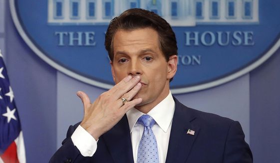 In this July 21, 2017, file photo, Anthony Scaramucci, right, blows a kiss after answering questions during the press briefing in the Brady Press Briefing room of the White House in Washington. (AP Photo/Pablo Martinez Monsivais, File)