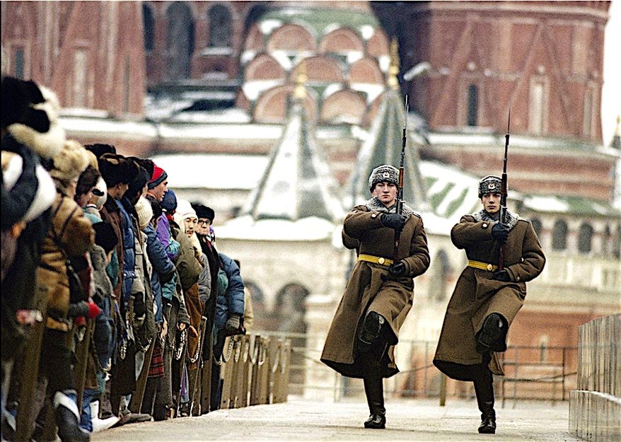 Soviet citizens stand by during the changing of the guard at Lenin's Mausoleum in Red Square, Moscow, Russia, on Dec. 11, 1991. (Alexander Zemlianichenko/Associated Press)
