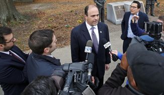 FILE- In this Dec. 20, 2017, file photo, Del. David Yancey talks with reporters outside the Newport News, Va., Courthouse. Shelly Simonds, the Democrat in a tied race for a Virginia House seat says she&#39;ll ask a court to declare the tie invalid. Simonds&#39; lawyers said Tuesday, Dec. 26, that they&#39;ll ask the court to reconsider its ruling after last week&#39;s recount. Attorney Ezra Reese said the court violated election law by counting a ballot for Yancey a day after the recount. (Jonathon Gruenke/The Daily Press via AP, File)