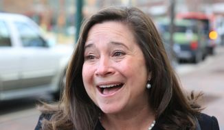 FILE- In this Dec. 19, 2017, file photo, Democrat Shelly Simonds reacts to the news that she won the 94th District precincts by one vote following a recount in Hampton, Va. Simonds, the Democrat in a tied race for a Virginia House seat that could affect which party controls the chamber says she&#39;ll ask a court to declare the tie invalid. Simonds&#39; lawyers said Tuesday, Dec. 26, that they&#39;ll ask the court to reconsider its ruling after last week&#39;s recount. (Joe Fudge/The Daily Press via AP, File)