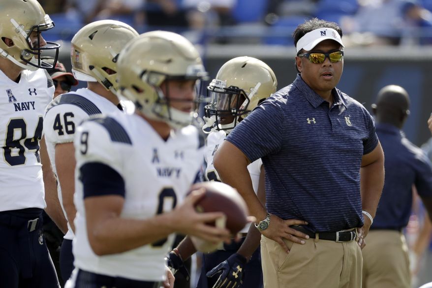 File- This Oct. 14, 2017, file photo shows Navy head coach Ken Niumatalolo watching as players warm up before an NCAA college football game, in Memphis, Tenn. Navy (6-6) will be making its 14th bowl appearance over the last 15 years. But it’s been an up and down season for the Midshipmen, who have lost six of seven following a 5-0 start and are coming off a disheartening 14-13 loss to Army. Navy desperately wants to avoid being saddled with a losing record for the first time since 2011. Playing at home should help.“From a preparation standpoint, you can’t beat this,” Niumatalolo said. “You’ve got everything like you would in a normal game.” (AP Photo/Mark Humphrey, File)