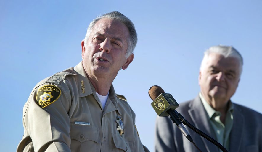 Clark County Sheriff Joe Lombardo, left, and Clark County Commission Chairman Steve Sisolak respond to questions during a news conference on New Year's Eve security at Metro Police Headquarters in Las Vegas Wednesday, Dec. 27, 2017. Glass bottles, backpacks and coolers are not permitted on The Strip on New Year's Eve, police said. (Steve Marcus/Las Vegas Sun via AP)