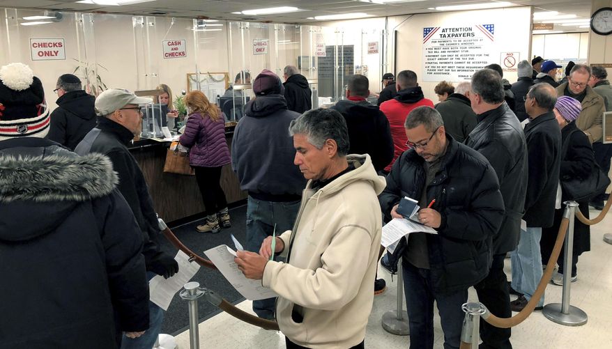 New Yorkers and others from blue states lined up to pay their real estate taxes before the end of last year, hoping to take advantage of a major deduction before it was wiped out by a federal overhaul that puts a $10,000 limit on state and local tax deductions. (Associated Press/File)