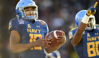 Navy&#39;s quarterback Malcolm Perry scores a touchdown against Virginia in the first half of the Military Bowl NCAA college football game, Thursday, Dec. 28, 2017, in Annapolis, Md. (AP Photo/Gail Burton)
