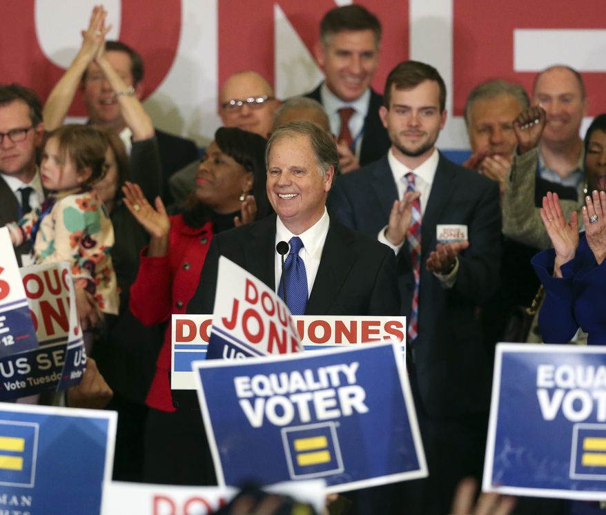 In this Tuesday, Dec. 12, 2017, file photo, Democrat Doug Jones speaks in Birmingham, Ala.  Roy Moore is going to court to try to stop Alabama from certifying Jones as the winner of the U.S. Senate race. Moore filed a lawsuit Wednesday evening, Dec. 27, 2017, in Montgomery Circuit Court. (AP Photo/John Bazemore, File)