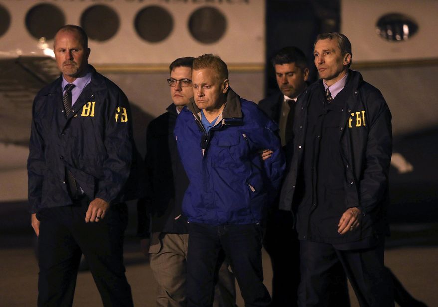 FILE - In this Dec. 5, 2017, file photo, fugitive lawyer Eric Conn is taken into custody by FBI agents on the tarmac at Blue Grass Airport in Lexington, Ky. A federal judge has ruled on Thursday, Dec. 28, 2017, that Coon, who went on the run in a more than $500 million Social Security fraud case must forfeit property put up for bond. WKYT-TV reports the judge ruled Thursday that Conn violated the terms of his bond. (AP Photo/Matt Goins, File)