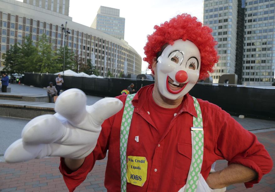 In this Thursday, Sept. 28, 2017 photo, Pat Payaso, a candidate for Boston City Council, takes a moment to talk politics on City Hall Plaza in Boston. Payaso’s last name means clown in Spanish, and he dresses like one, right down to the makeup, red nose, baggy pants and rainbow fright wig, which explains why he caused such a stir by running for a seat on the Boston City Council. New England craved a little comic relief in 2017, and the mirth gods came through with all manner of welcome weirdness. (John Wilcox/The Boston Herald via AP)