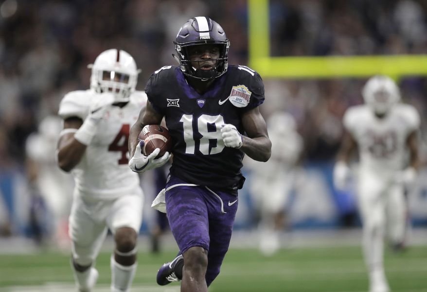 TCU wide receiver Jalen Reagor (18) scores on a 93-yard touchdown reception against Stanford during the second half of the Alamo Bowl NCAA college football game Thursday, Dec. 28, 2017, in San Antonio. (AP Photo/Eric Gay)