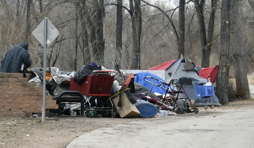 This Dec. 12, 2017, photo shows a homeless camp in Colorado Springs, Colo. (Jerilee Bennett/The Gazette via AP)