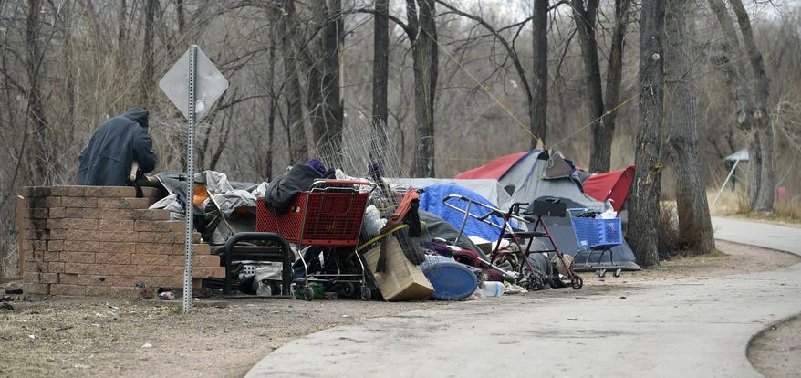 This Dec. 12, 2017, photo shows a homeless camp in Colorado Springs, Colo. (Jerilee Bennett/The Gazette via AP)