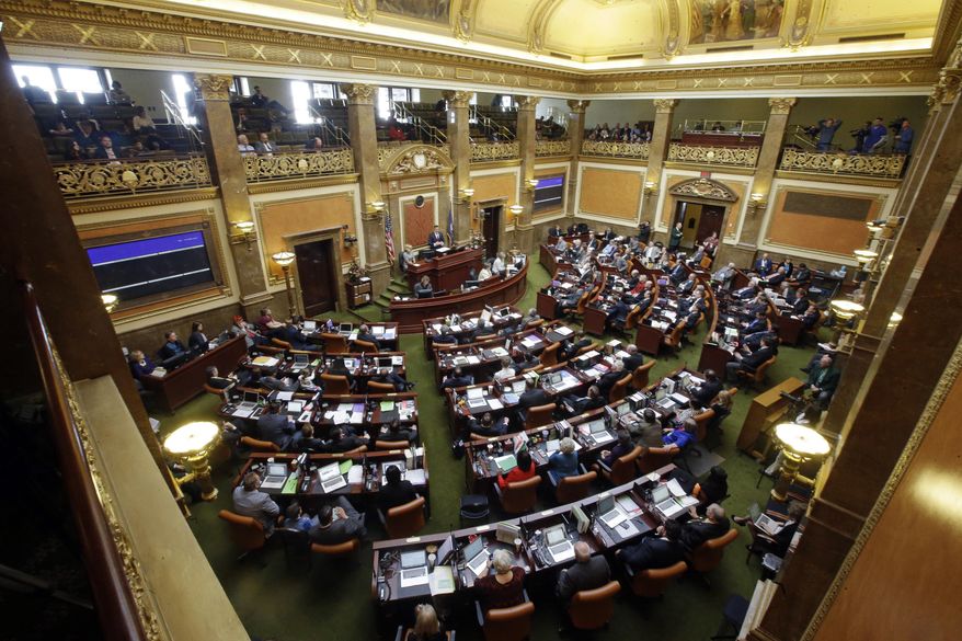 FILE - This Jan. 25, 2016, file photo, members of the House of Representatives look on as House Speaker Greg Hughes speaks, in Salt Lake City. Utah drivers in 2018 will save some money after lawmakers eliminated a required car safety check, but visitors to Utah hotels, motels and campgrounds will feel a slight pinch in their pocketbooks under a new tax. The changes are among a handful of new laws taking effect in Utah on Jan. 1, 2018. (AP Photo/Rick Bowmer, File)
