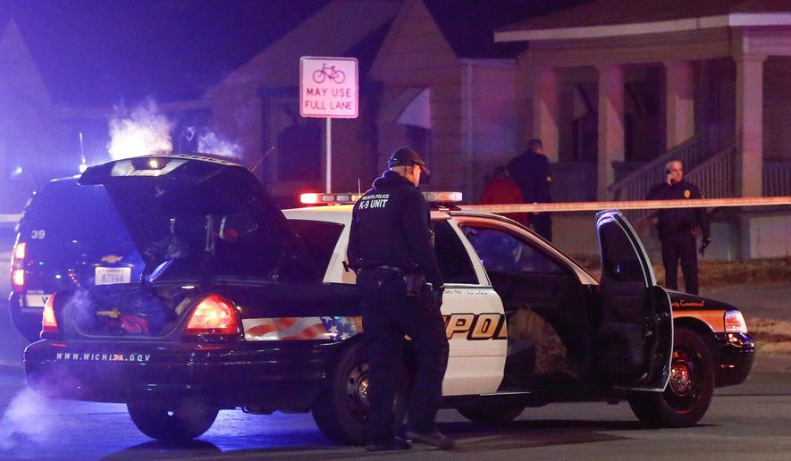 Wichita police investigate a call of a possible hostage situation near the corner of McCormick and Seneca in Wichita, Ks Thursday night 12/28. A man was fatally shot by a police officer in what is believed to be a gaming prank called &amp;quot;swatting.&amp;quot; (Fernando Salazar /The Wichita Eagle via AP)