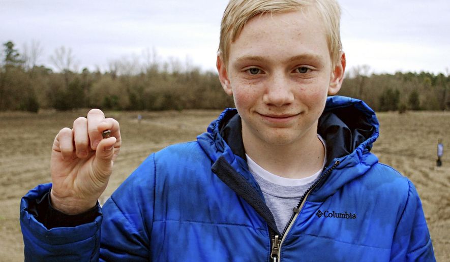 FILE- This March 11, 2017, file photo, provided by the Arkansas Department of Parks & Tourism shows Kalel Langford holding a 7.44 carat diamond he found at Crater of Diamonds State Park in Murfreesboro, Ark. The story was one of Arkansas' oddest news stories of 2017. (Waymon Cox/Arkansas Department of Parks & Tourism via AP, File)