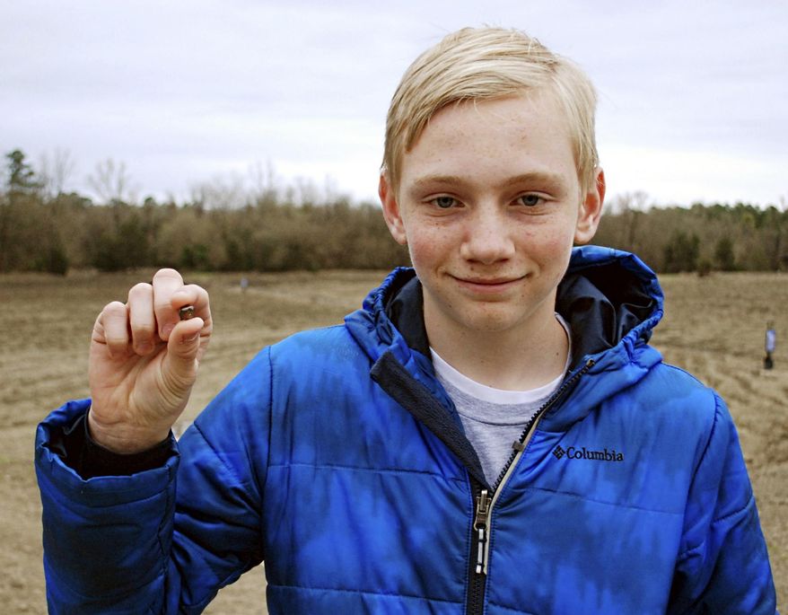 FILE- This March 11, 2017, file photo, provided by the Arkansas Department of Parks & Tourism shows Kalel Langford holding a 7.44 carat diamond he found at Crater of Diamonds State Park in Murfreesboro, Ark. The story was one of Arkansas' oddest news stories of 2017. (Waymon Cox/Arkansas Department of Parks & Tourism via AP, File)