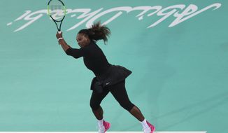Serena Williams from the U.S. returns the ball to Jelena Ostapenko of Latvia during the final day of the Mubadala World Tennis Championship in Abu Dhabi, United Arab Emirates, Saturday, Dec. 30, 2017. (AP Photo/Kamran Jebreili)