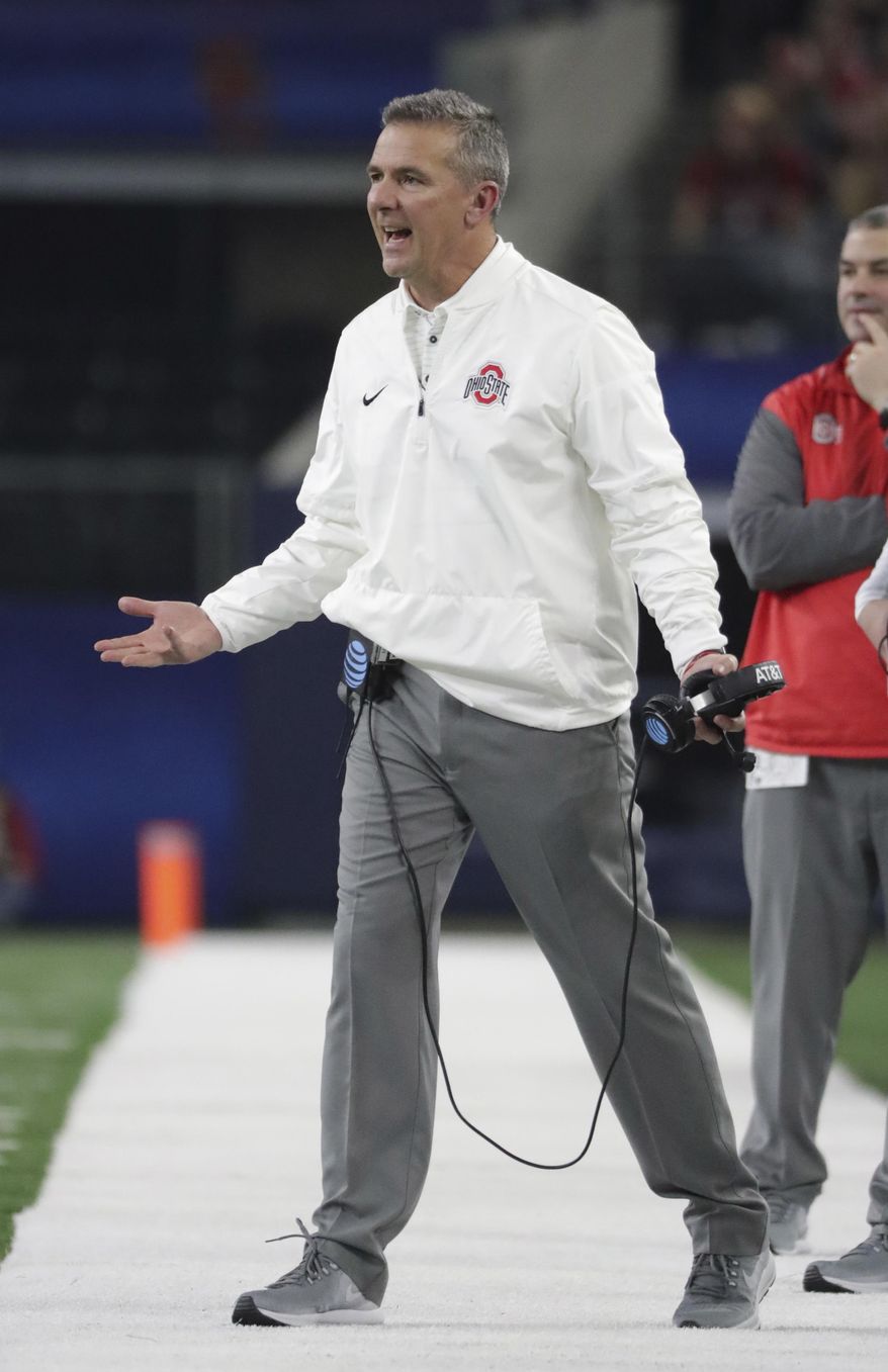Ohio State coach Urban Meyer yells from the sideline during the first half of the team's Cotton Bowl NCAA college football game against Southern California in Arlington, Texas, Friday, Dec. 29, 2017. (AP Photo/LM Otero)