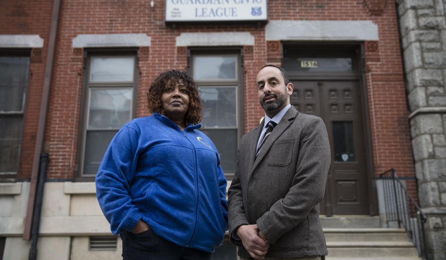 In a Friday, Dec. 22, 2017 photo, Rochelle Bilal, president of the Guardian Civic League and attorney Brian R. Mildenberg pose for a photograph in Philadelphia. Officers in the Philadelphia Police Department’s narcotics unit have sued their bosses for allegedly ordering them to lie on arrest paperwork about their informants to “make the drugs go away,” a practice that experts say raises the possibility of corruption and illegitimate prosecutions. Mildenberg is representing the group of African-American plaintiffs that include a staff inspector, a lieutenant and a captain who all work in the narcotics bureau and say they were racially discriminated against for refusing to carry out the request. (AP Photo/Matt Rourke)