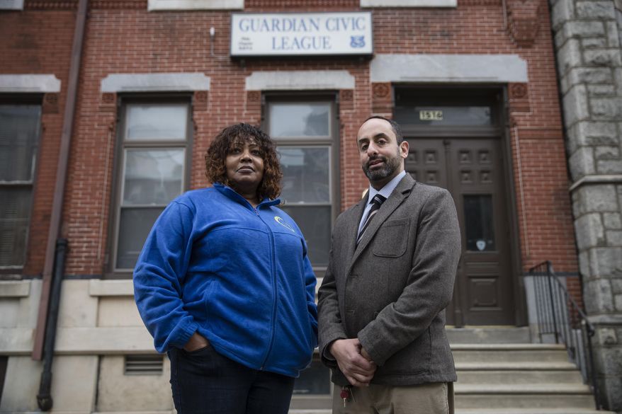 In a Friday, Dec. 22, 2017 photo, Rochelle Bilal, president of the Guardian Civic League and attorney Brian R. Mildenberg pose for a photograph in Philadelphia. Officers in the Philadelphia Police Department’s narcotics unit have sued their bosses for allegedly ordering them to lie on arrest paperwork about their informants to “make the drugs go away,” a practice that experts say raises the possibility of corruption and illegitimate prosecutions. Mildenberg is representing the group of African-American plaintiffs that include a staff inspector, a lieutenant and a captain who all work in the narcotics bureau and say they were racially discriminated against for refusing to carry out the request. (AP Photo/Matt Rourke)