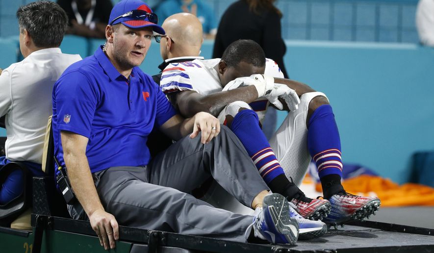 Buffalo Bills running back LeSean McCoy (25) is driven off the field after he was injured on a play, during the second half of an NFL football game against the Miami Dolphins, Sunday, Dec. 31, 2017, in Miami Gardens, Fla. (AP Photo/Wilfredo Lee)