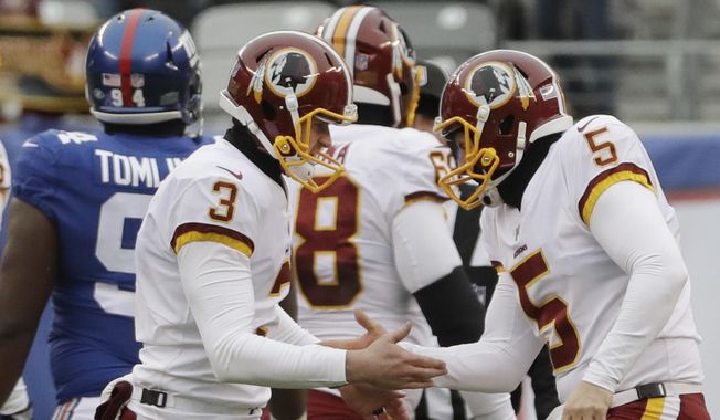 Washington Redskins&#x27; Dustin Hopkins (3) and Tress Way (5) celebrate after Hopkins kicked a field goal during the first half of an NFL football game against the New York Giants Sunday, Dec. 31, 2017, in East Rutherford, N.J. (AP Photo/Mark Lennihan) **FILE**